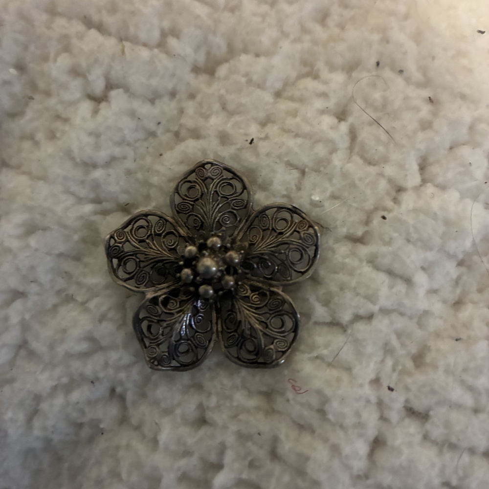 Beau Sterling silver filigree flower brooch.